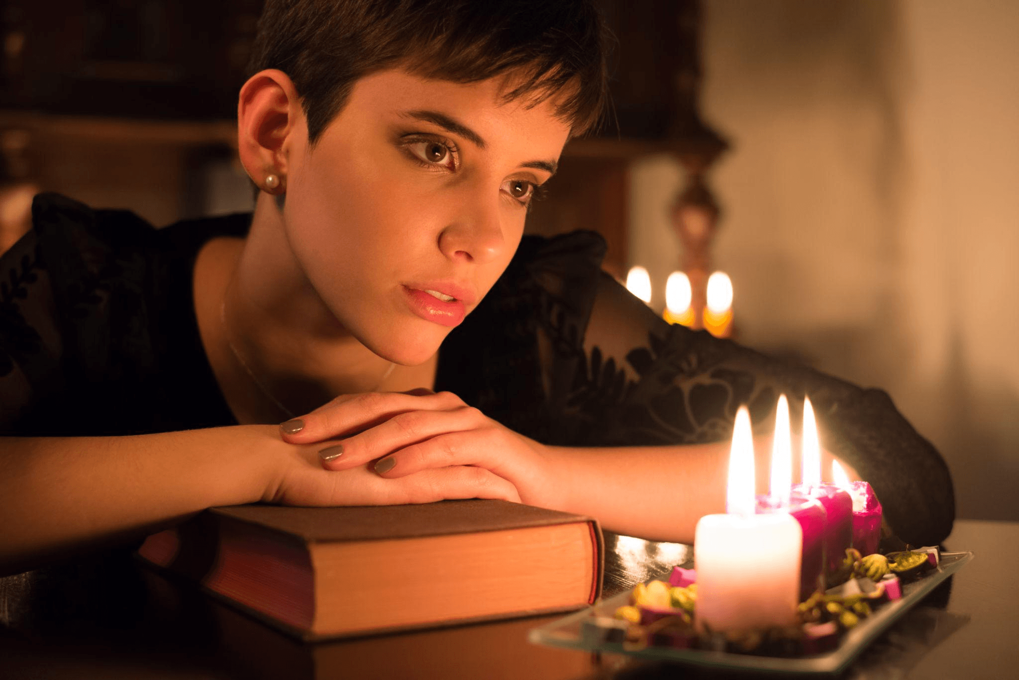 Contemplative reading by candlelight — seeking wisdom through ancient traditions